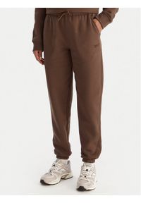 Reebok Spodnie dresowe Reebok X Ewa Chodakowska Evren RK25308CCW Brązowy Regular Fit. Kolor: brązowy. Materiał: bawełna, syntetyk #1