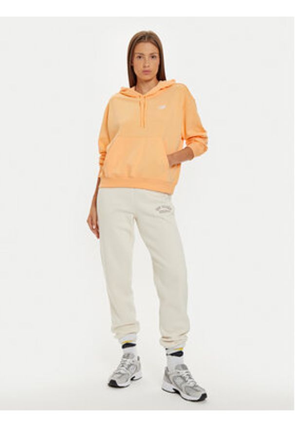 New Balance Bluza WT41507 Pomarańczowy Relaxed Fit. Kolor: pomarańczowy. Materiał: syntetyk