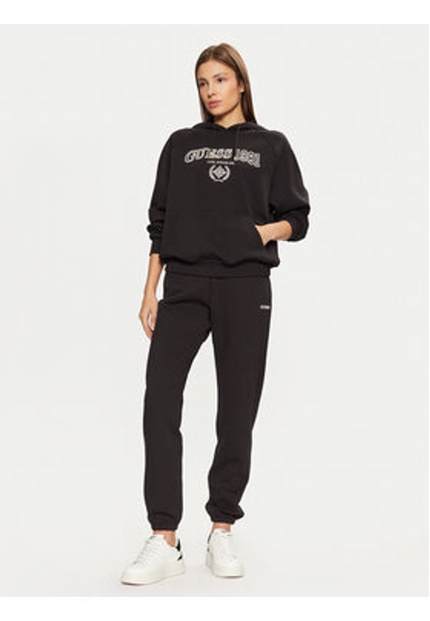 Guess Spodnie dresowe V5RB02 KCLD1 Brązowy Regular Fit. Kolor: brązowy. Materiał: bawełna
