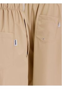 Rains Spodnie materiałowe Unisex 18560 Beżowy Comfortable Fit. Kolor: beżowy. Materiał: syntetyk, materiał