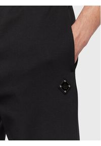 J.Lindeberg Spodnie dresowe Creed FMJS0651 Czarny Relaxed Fit. Kolor: czarny. Materiał: bawełna, syntetyk #4