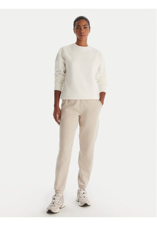 Reebok Spodnie dresowe Reebok X Ewa Chodakowska Evren RK25308CCW Beżowy Regular Fit. Kolor: beżowy. Materiał: syntetyk, bawełna