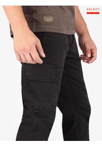 Volcano - Męskie spodnie bojówki ze ściągaczami na dole R‑ALPIN. Stan: obniżony. Kolor: czarny. Materiał: elastan, skóra, bawełna. Styl: sportowy #1