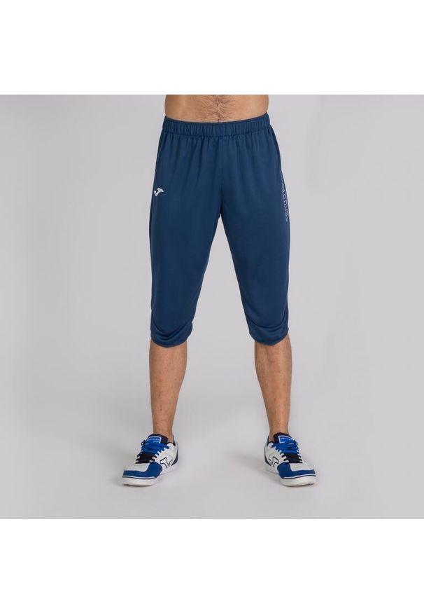 Spodnie do piłki nożnej męskie Joma Championship III Vela 3/4. Kolor: niebieski