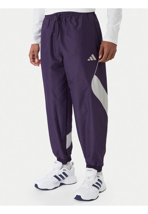 Adidas - adidas Spodnie dresowe Stadium JX5610 Fioletowy Loose Fit. Kolor: fioletowy. Materiał: syntetyk