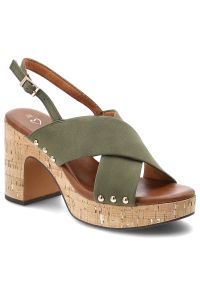 Sandały damskie Marco Tozzi, na wysokim słupku z krzyżowanymi paskami i regulowanym zapięciem przy pięcie osadzone na platformie o korkowym wykończen. Zapięcie: pasek. Kolor: zielony. Materiał: len. Wzór: paski. Sezon: lato. Obcas: na platformie. Styl: elegancki, klasyczny. Wysokość obcasa: średni #4